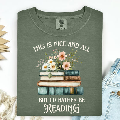 Moss green t-shirt with "This is nice and all but I'd rather be reading" text, vintage books, and wildflowers.