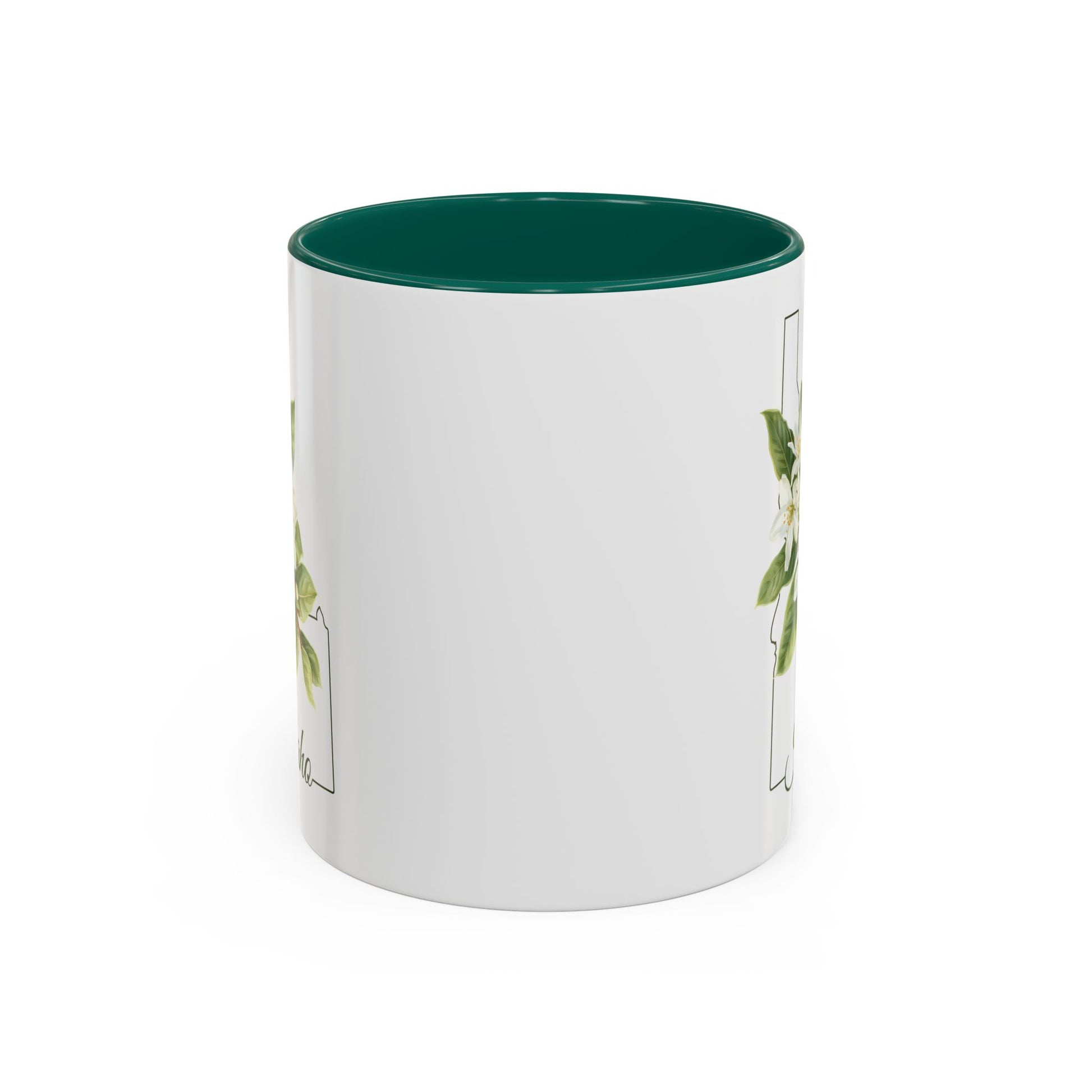 White ceramic mug with a green interior and handle, featuring a delicate Syringa flower illustration within the Idaho state silhouette.