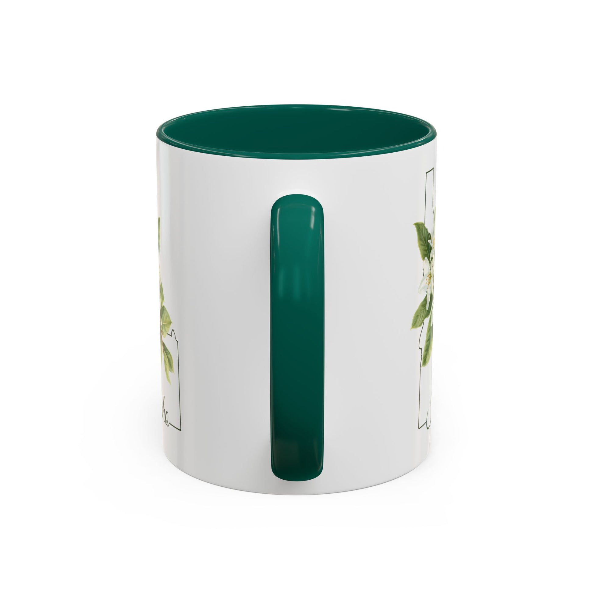 White ceramic mug with a dark green handle and interior, featuring a watercolor Syringa flower within the Idaho state silhouette.