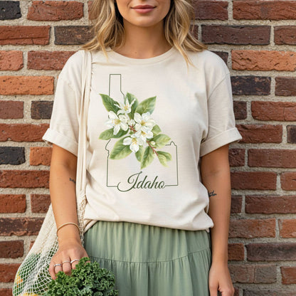 Relaxed-fit, garment-dyed cream t-shirt with Idaho outline and white Syringa blossoms design.