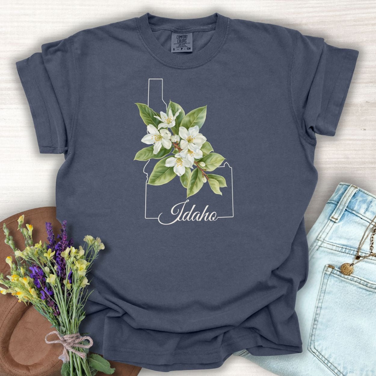 Denim S t-shirt with Idaho outline, Syringa flowers, and "Idaho" script.