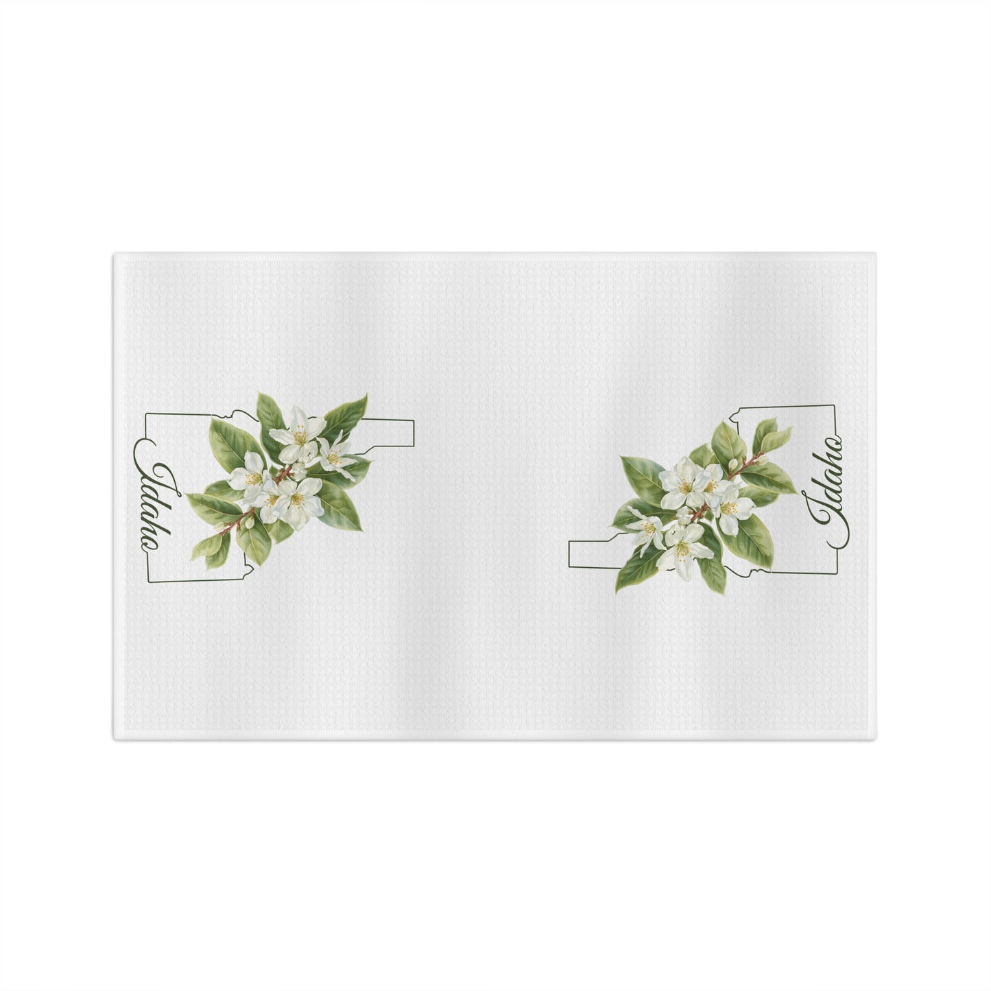 White microfiber tea towel with Idaho state outline and Syringia (mock orange) floral design.