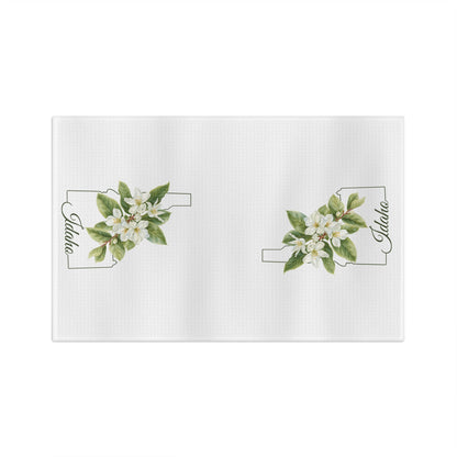 White microfiber tea towel with Idaho state outline and Syringia (mock orange) floral design.