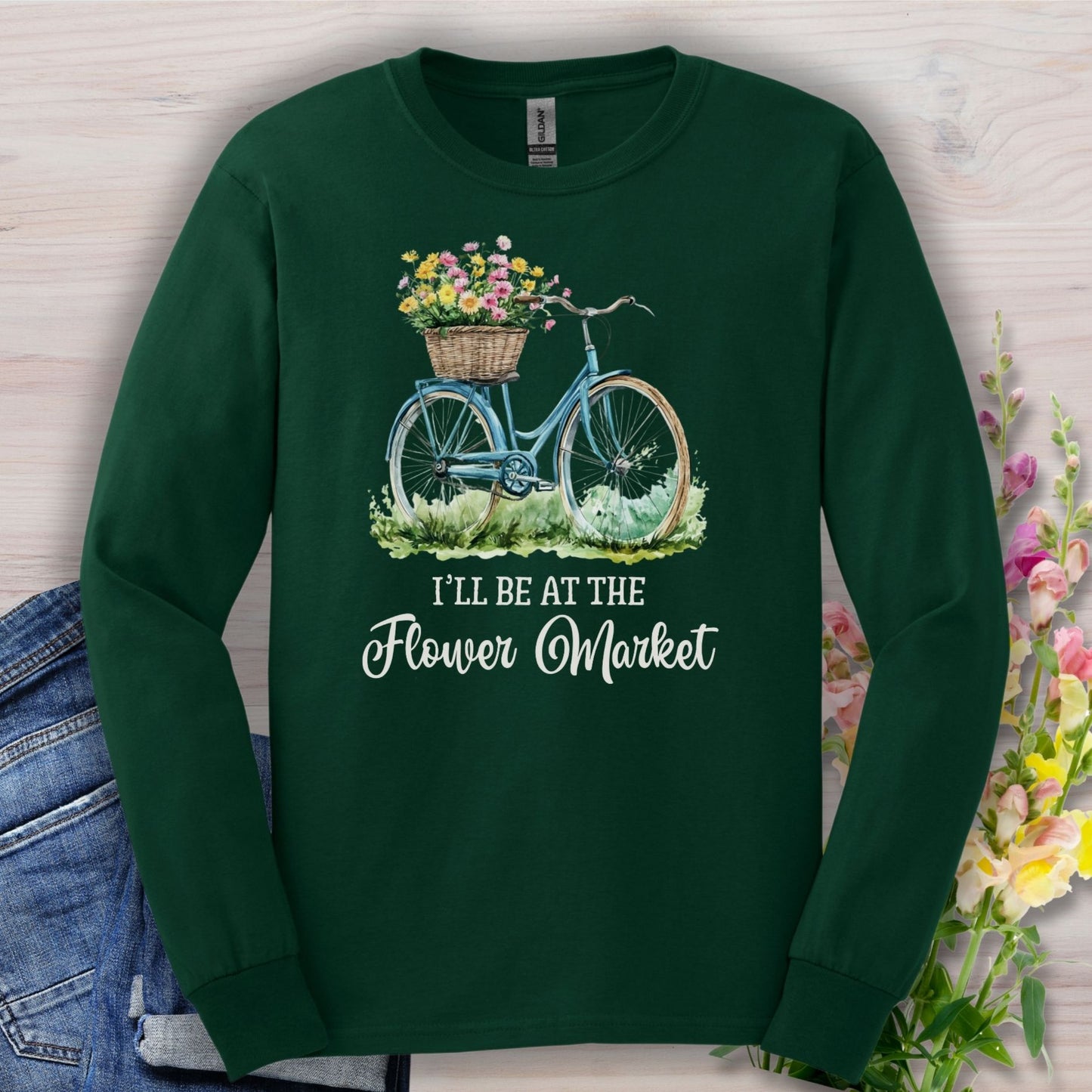 Forest Green long-sleeve cotton tee with a blue bicycle and flower basket graphic, "Flower Market" text.