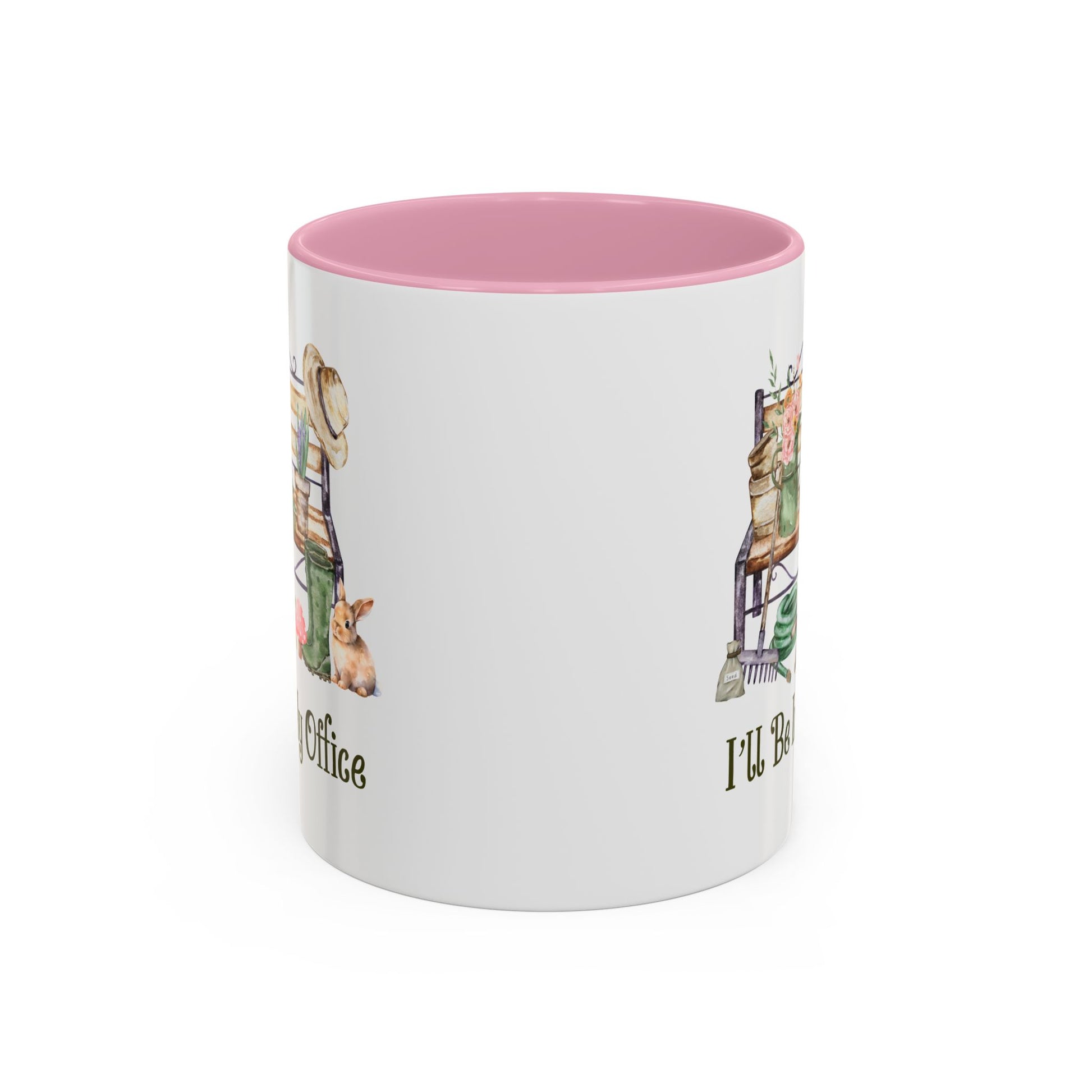 White ceramic gardener mug with pink interior and "I'll Be In My Office" text, featuring watercolor garden tools and a bunny.