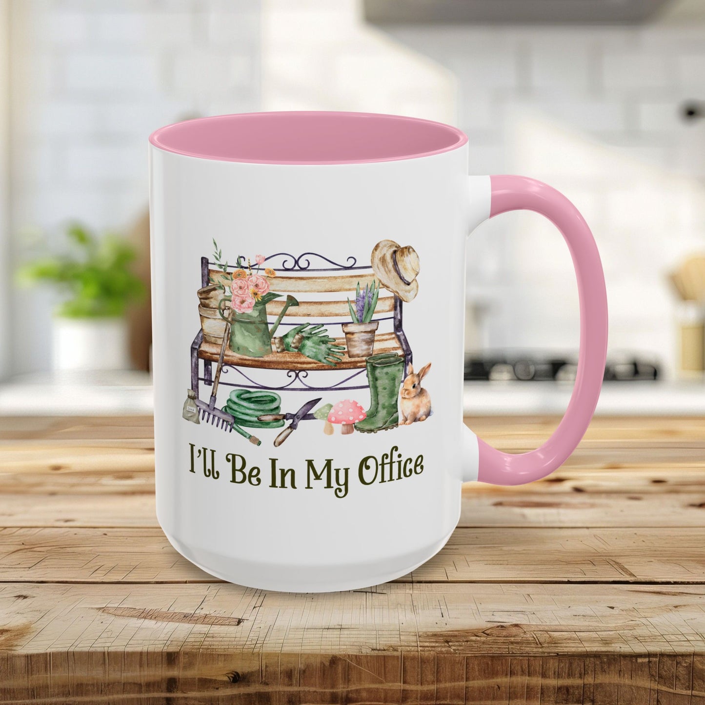 15oz white ceramic gardener mug with pink handle and interior, featuring "I'll Be In My Office" and garden tools.