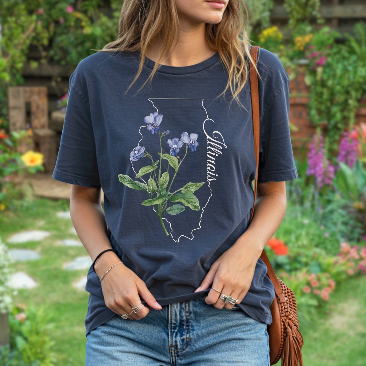 Navy garment-dyed cotton t-shirt with Illinois state outline, common blue violet illustration, and "Illinois" script.