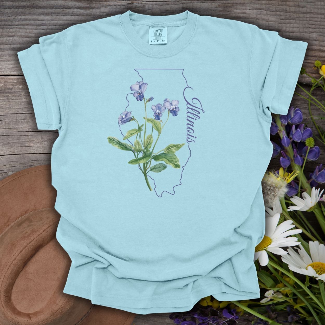 Chambray blue cotton t-shirt with a delicate common blue violet illustration over an Illinois state outline.