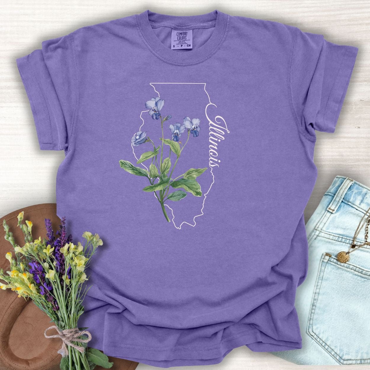 Grape S-sized garment-dyed cotton t-shirt with Illinois state outline and blue violet botanical illustration.