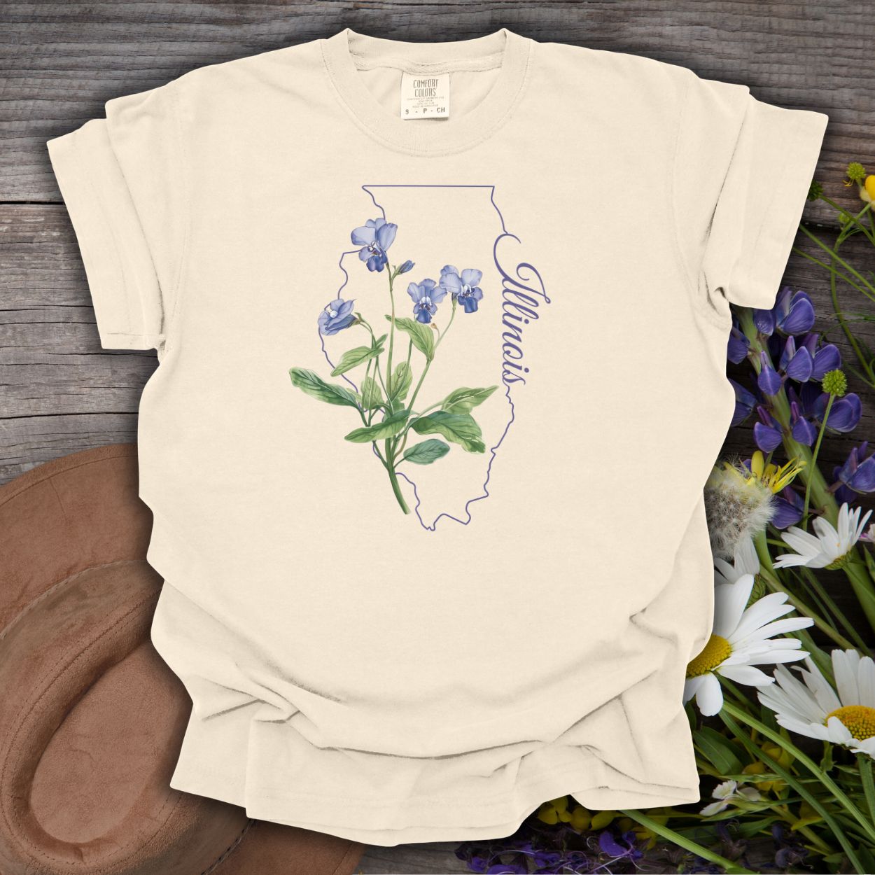 Ivory garment-dyed cotton t-shirt with a blue violet illustration over an Illinois state outline.