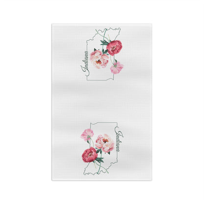 White microfiber tea towel with two pink peony floral designs inside the outline of Indiana.