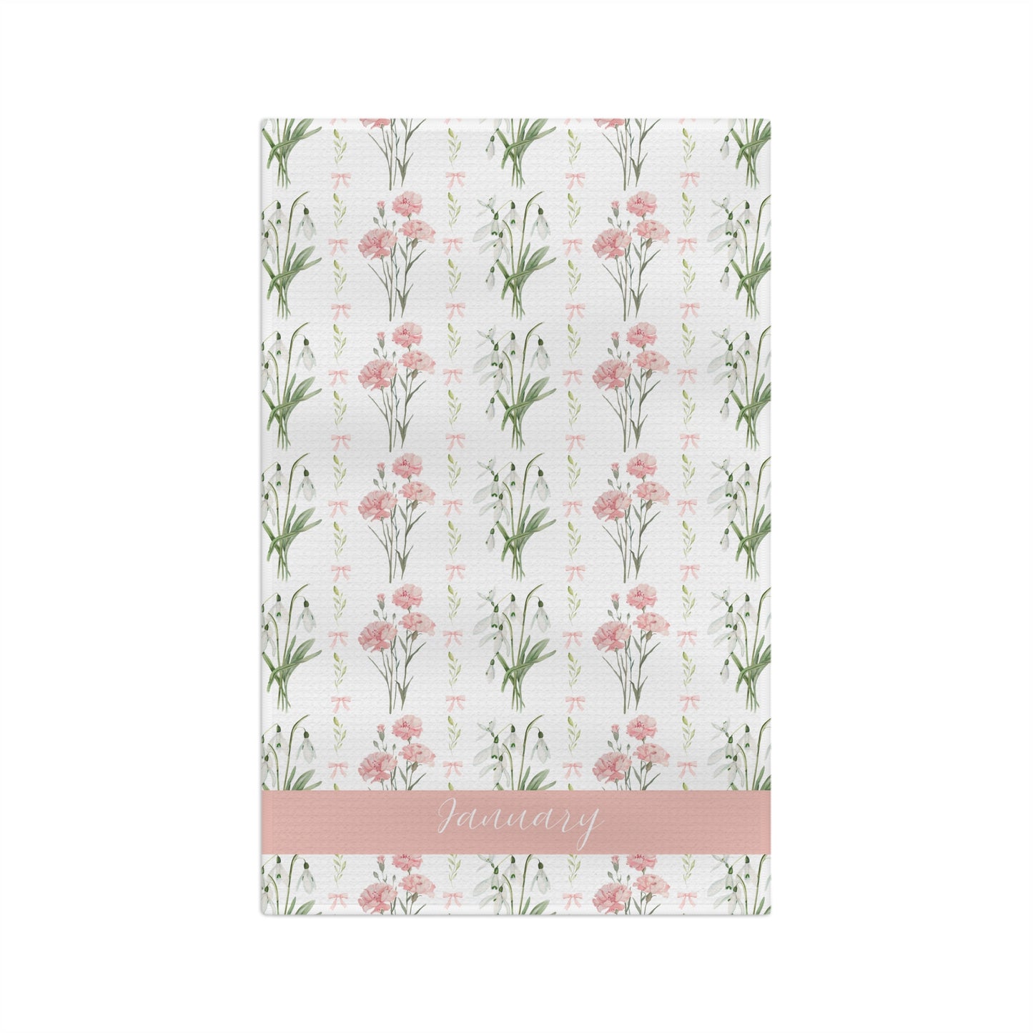 White microfiber tea towel with watercolor pink carnations, snowdrops, and "January" on a pink band.