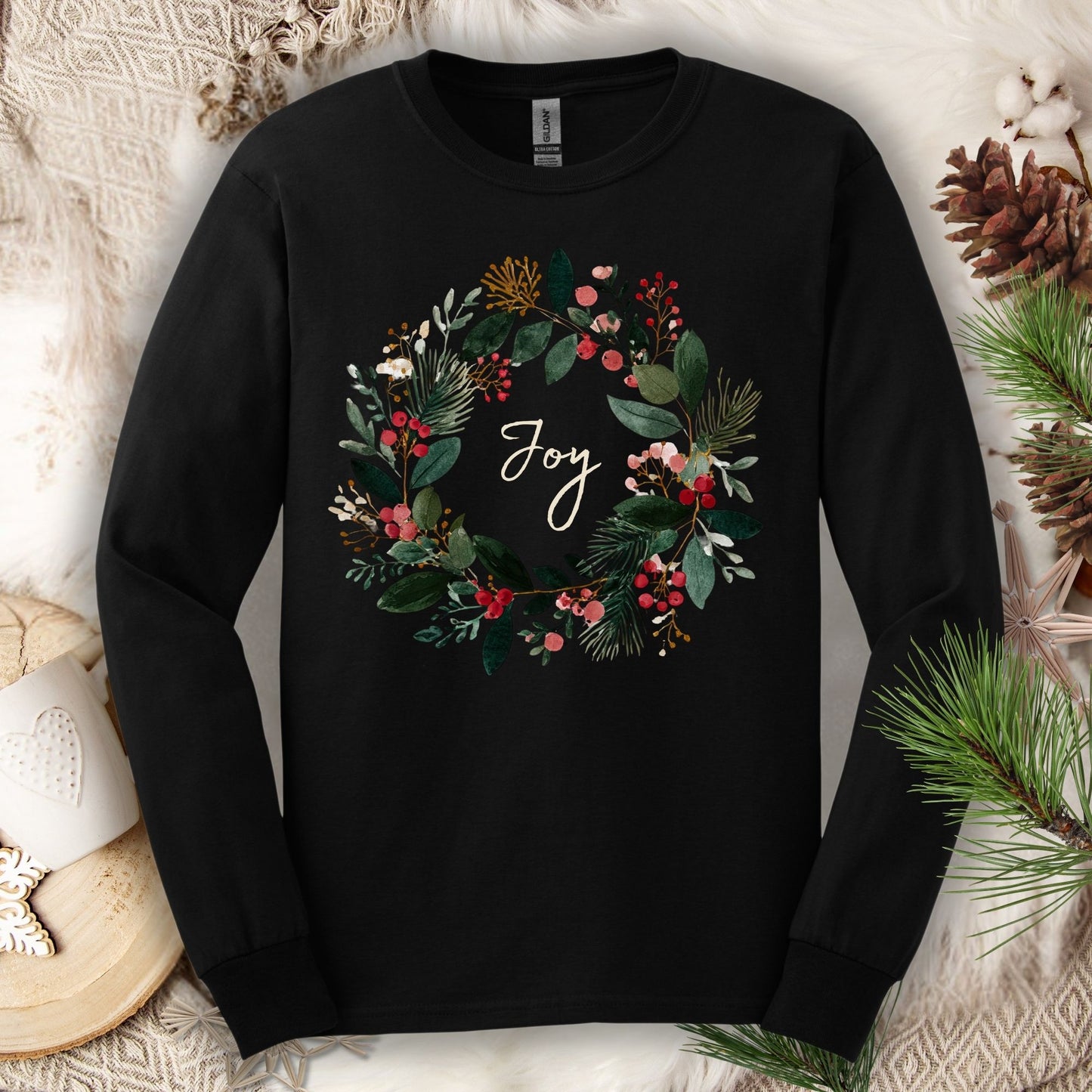 Black Gildan long sleeve tee with a watercolor Christmas wreath and "Joy" in the center.