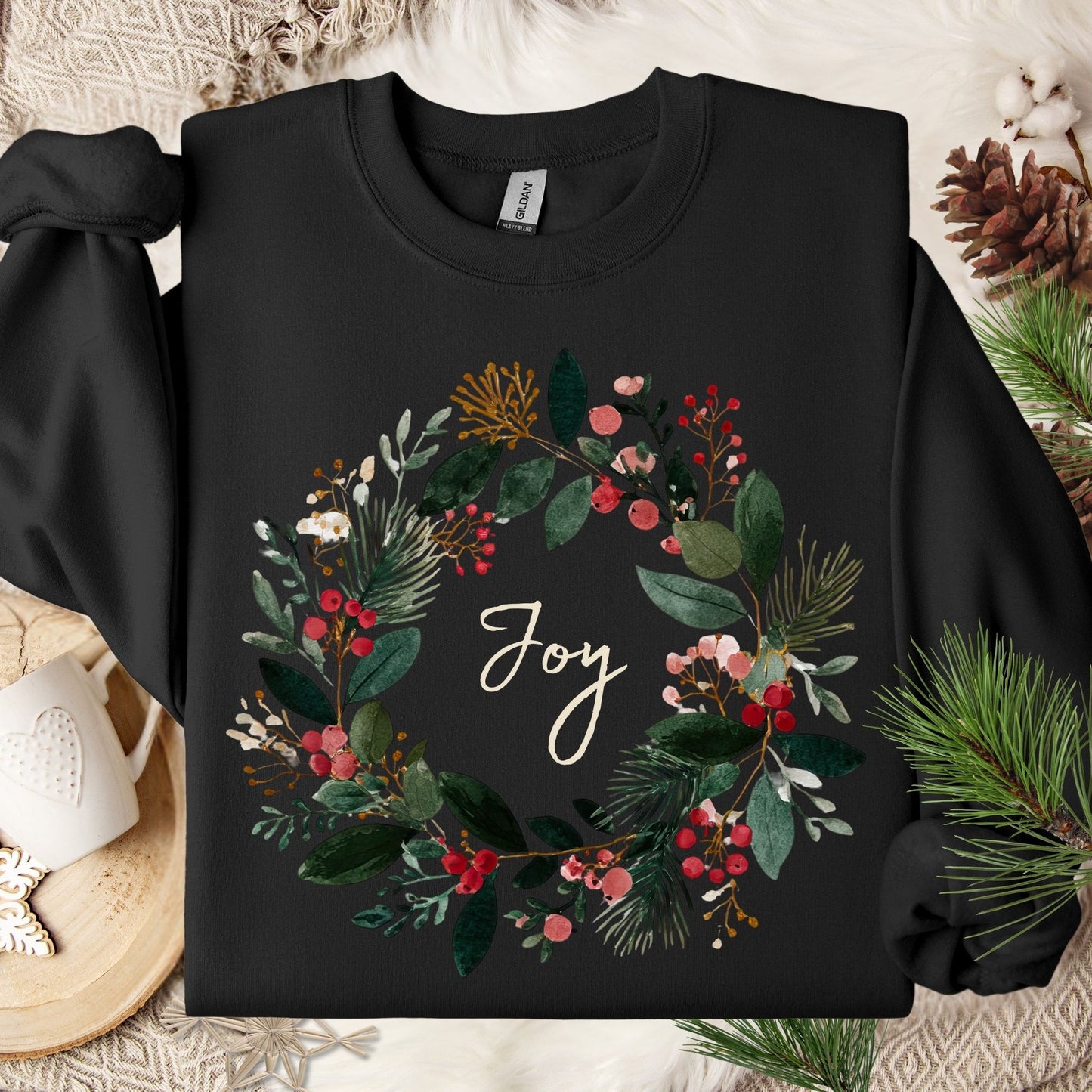 Black Gildan crewneck sweatshirt with a watercolor Christmas wreath and "Joy" in the center.