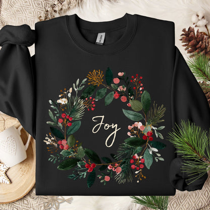 Black Gildan crewneck sweatshirt with a watercolor Christmas wreath and "Joy" in the center.