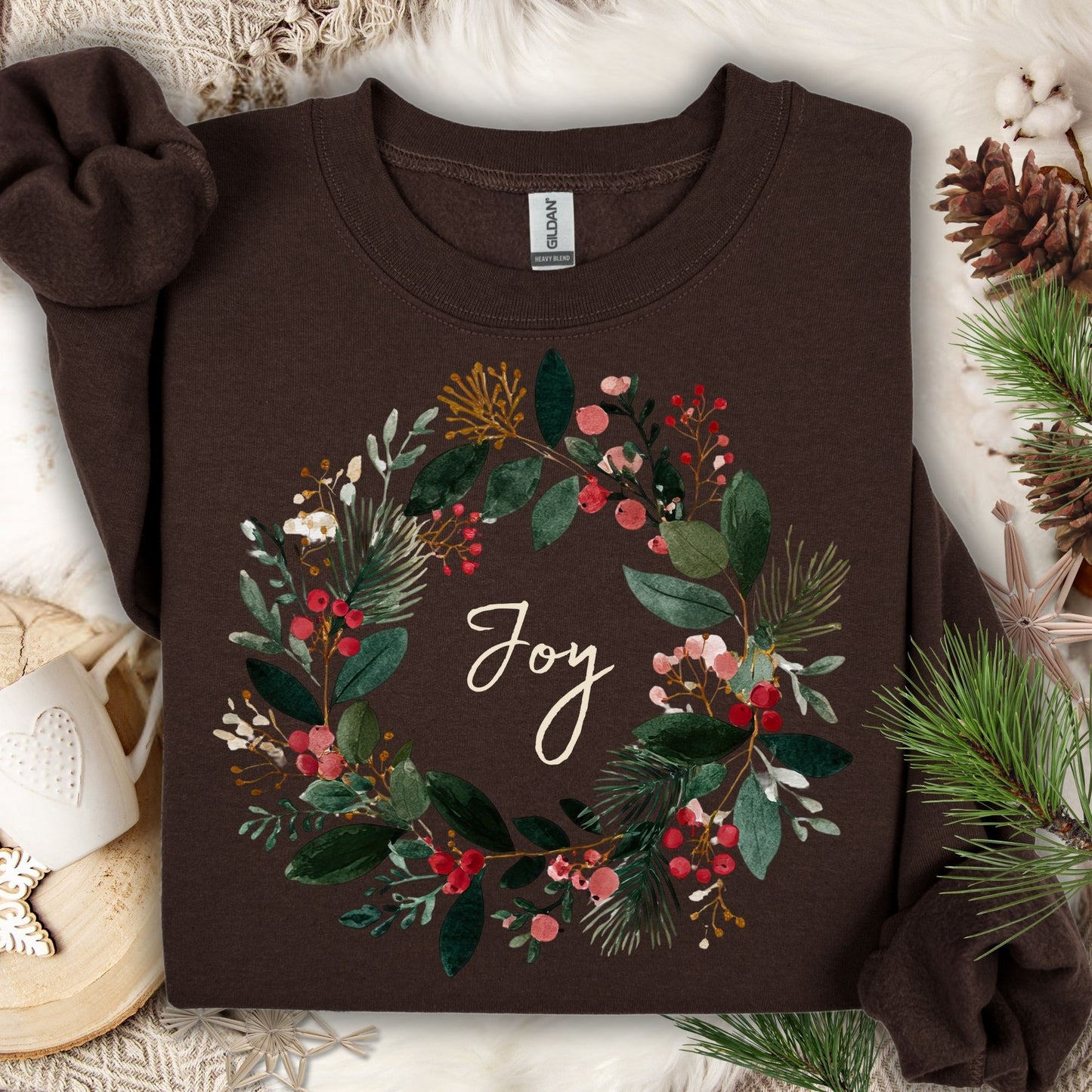 Dark Chocolate Gildan crewneck sweatshirt with a watercolor Christmas wreath and "Joy" in the center.
