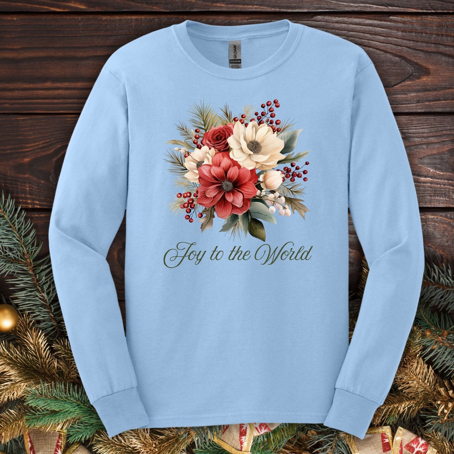 Light blue Gildan long sleeve tee with a watercolor Christmas bouquet and "Joy to the World" text.