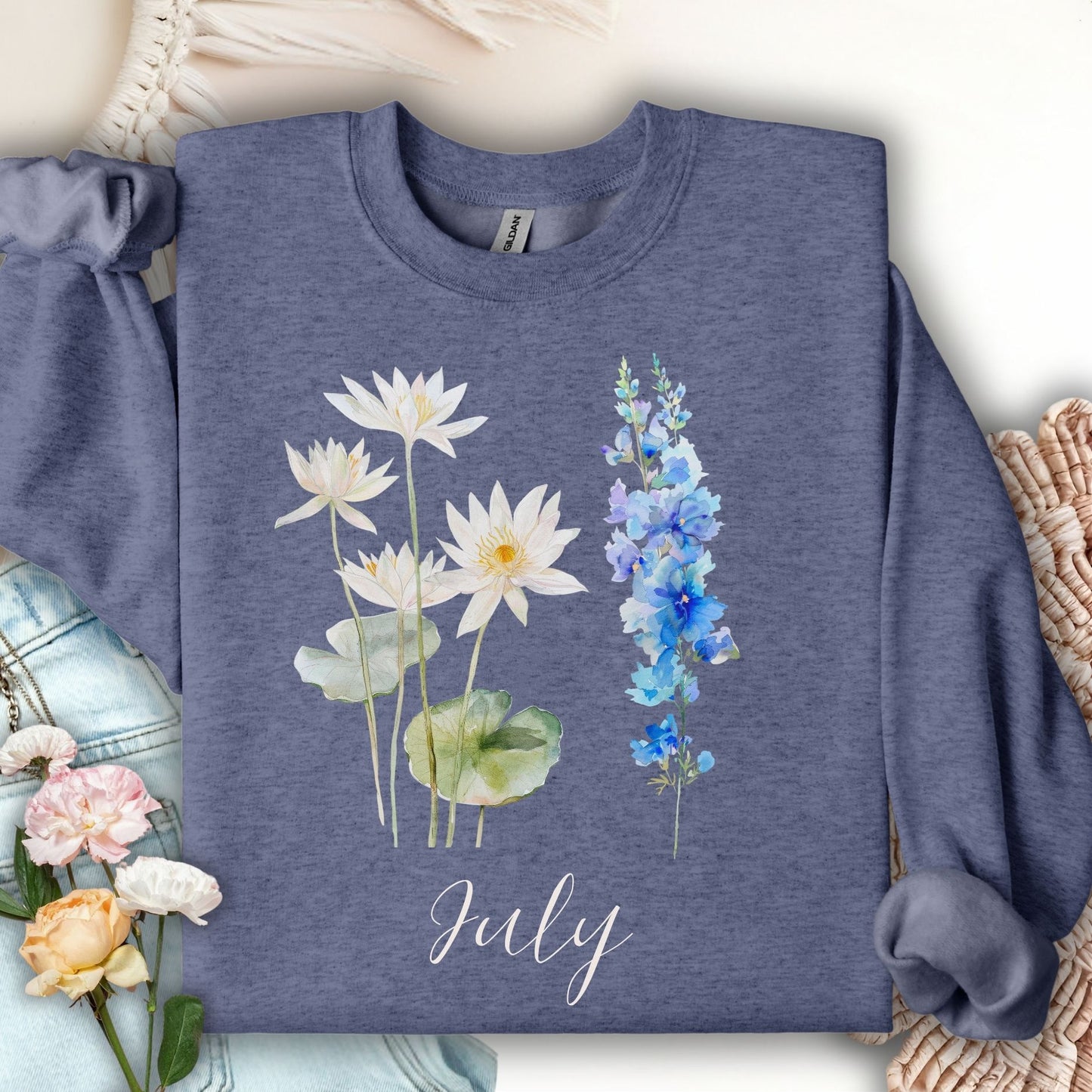 Heather Sport Dark Navy sweatshirt with watercolor waterlilies, larkspur, and "July" text.