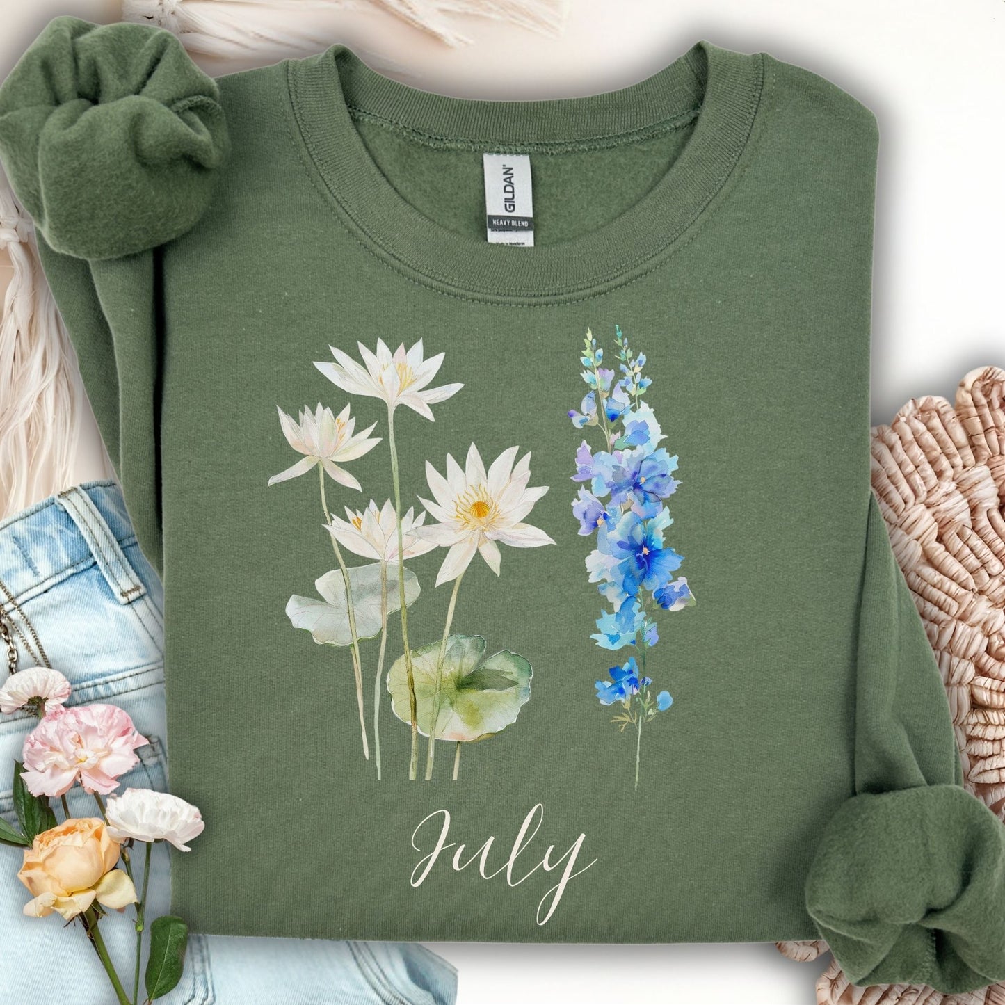 Military green cotton-poly sweatshirt with watercolor waterlilies, larkspur, and "July" text.
