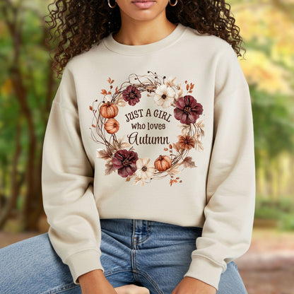 Beige cotton-blend sweatshirt with "Just a Girl who loves Autumn" text in a watercolor floral and pumpkin wreath.