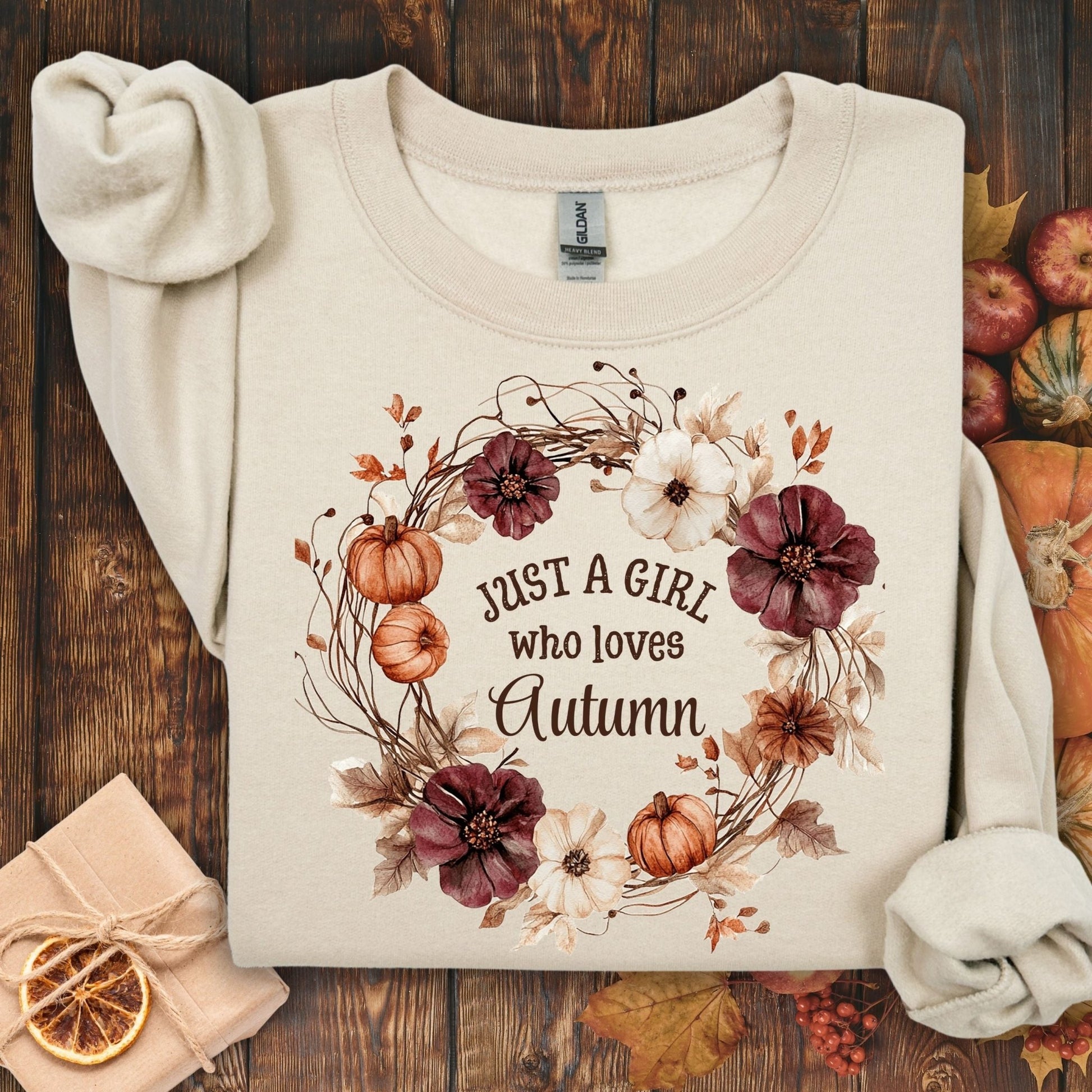 Sand cotton-blend sweatshirt with "Just a Girl who loves Autumn" text in a watercolor floral wreath.