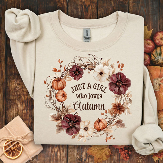 Sand cotton-blend sweatshirt with "Just a Girl who loves Autumn" text in a watercolor floral wreath.