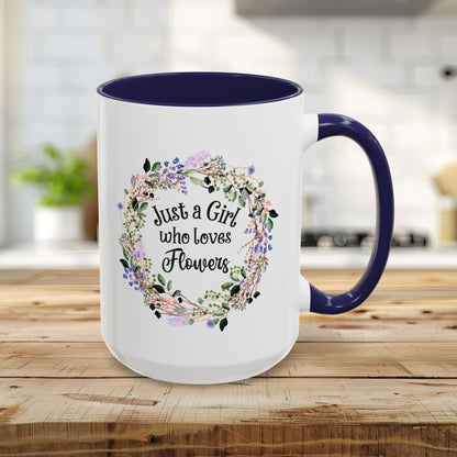 15oz white mug with navy interior/handle, "Just a Girl who Loves Flowers" in a watercolor floral wreath.