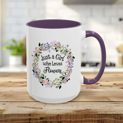 White 15oz mug with "Just a Girl who Loves Flowers" in a watercolor floral wreath, purple interior and handle.