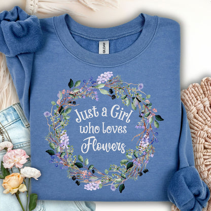 Indigo Blue unisex sweatshirt with "Just a Girl who loves Flowers" in a delicate floral wreath design.