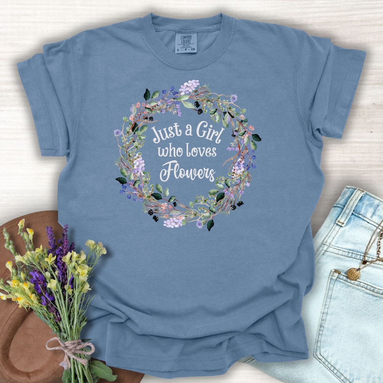 Blue Jean cotton t-shirt with "Just a Girl who Loves Flowers" in a watercolor floral wreath.