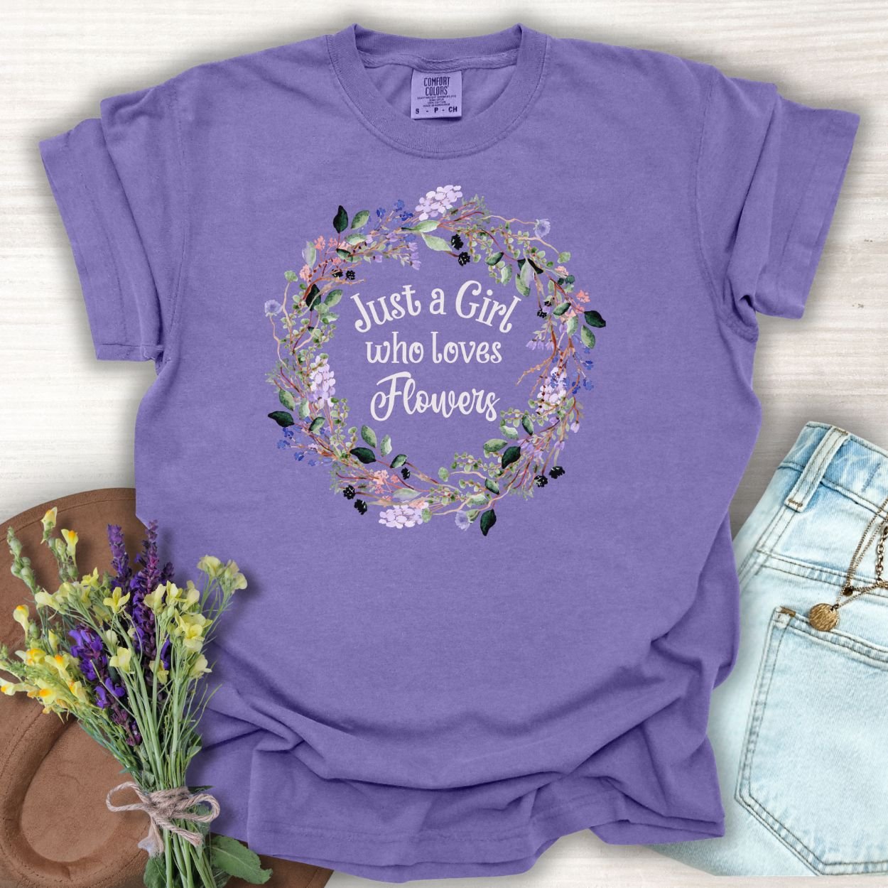 Grape "Just a Girl who Loves Flowers" t-shirt with a watercolor floral wreath design.