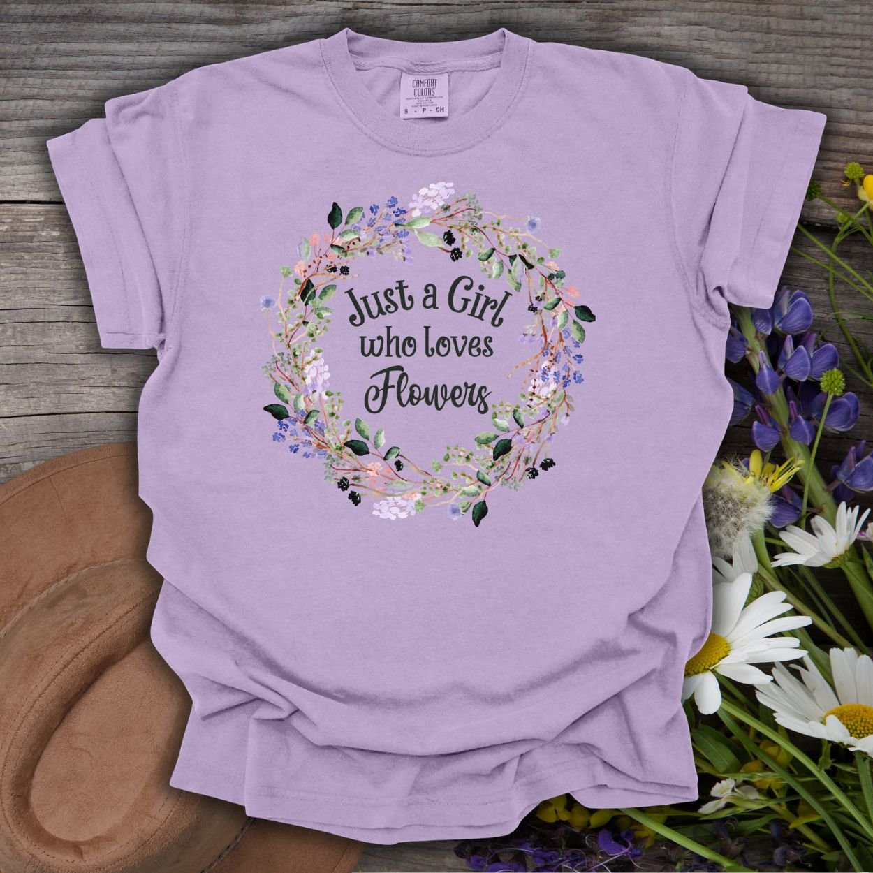 Orchid purple, garment-dyed cotton t-shirt with "Just a Girl who Loves Flowers" in a watercolor floral wreath.