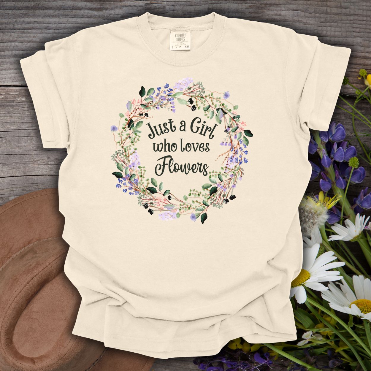 Ivory heavyweight cotton t-shirt with "Just a Girl who loves Flowers" in a watercolor floral wreath.