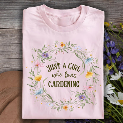 Light pink "Just a Girl Who Loves Gardening" t-shirt with a wildflower wreath design, size S.