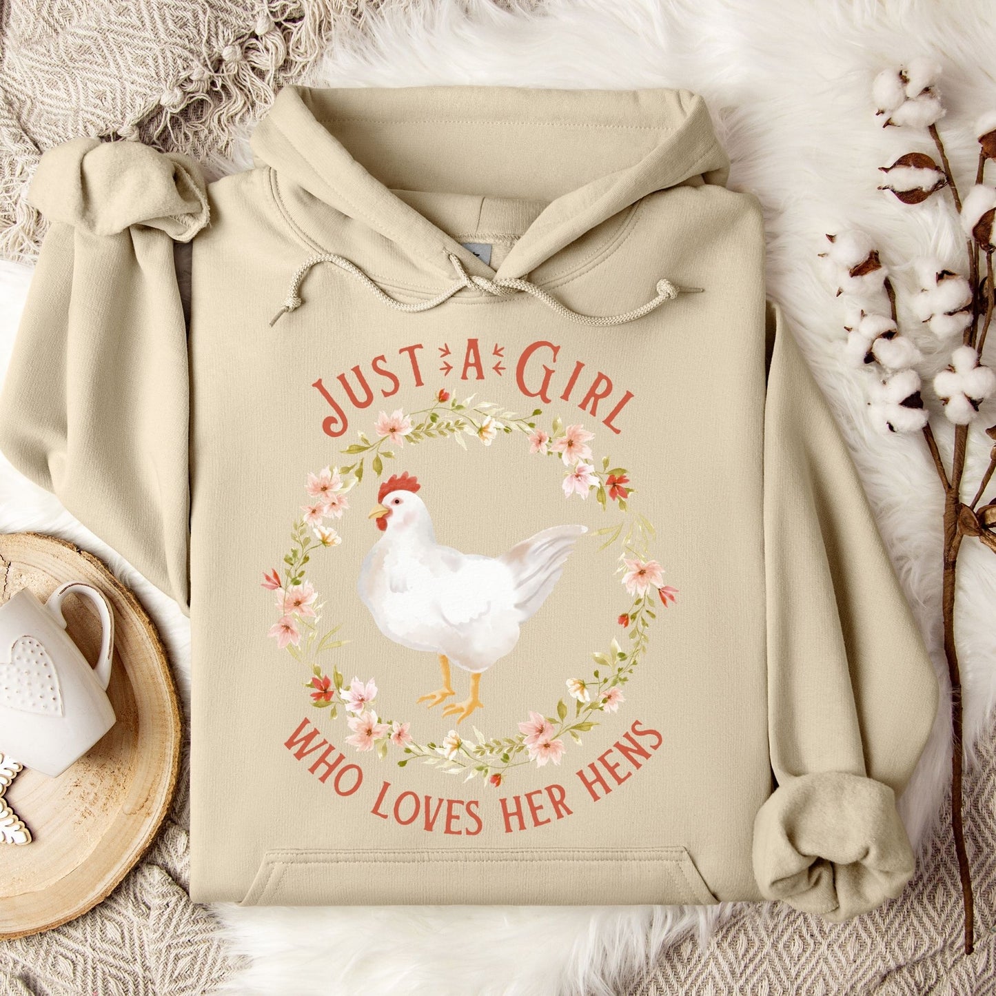 Sand Gildan 18500 hoodie with "Just a Girl Who Loves Her Hens" text and watercolor chicken in a floral wreath.