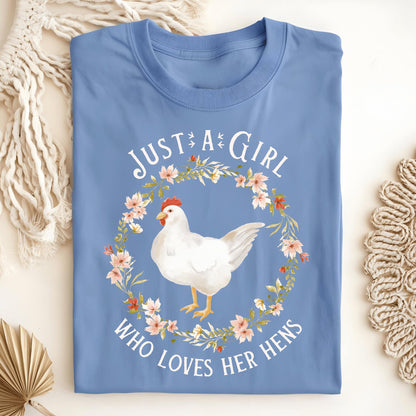 Carolina Blue "Just a Girl Who Loves Her Hens" t-shirt with a white hen in a floral wreath.