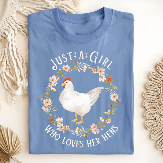 Carolina Blue "Just a Girl Who Loves Her Hens" t-shirt with a white hen in a floral wreath.