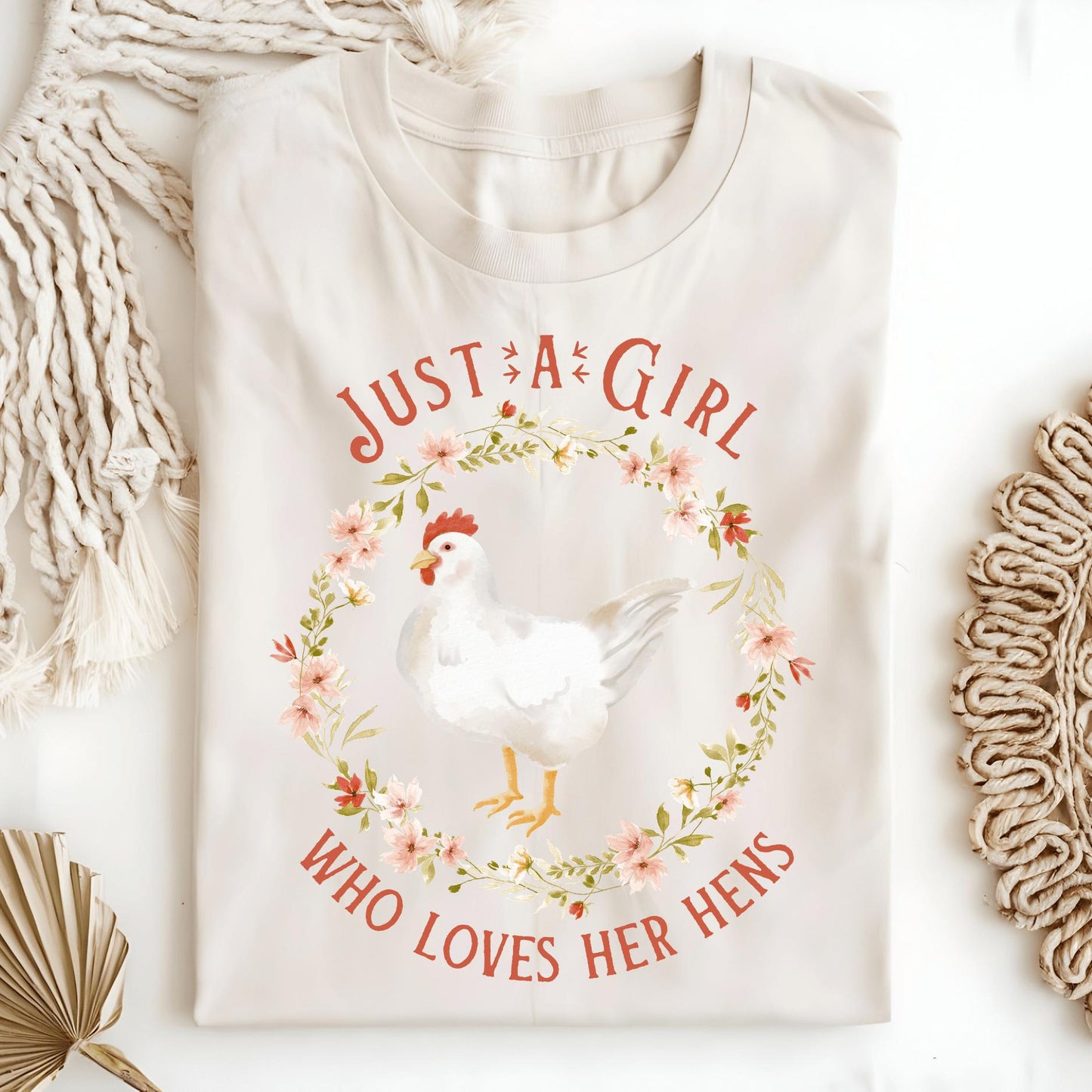 Natural S heavyweight cotton t-shirt with "Just a Girl Who Loves Her Hens" text and a chicken in a floral wreath.