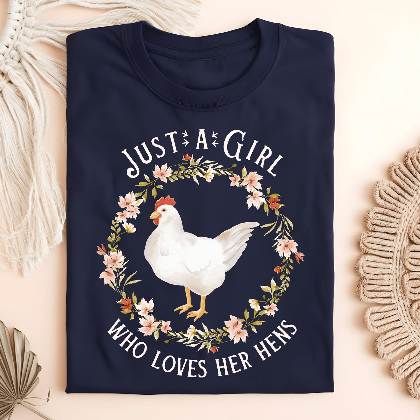 Navy S t-shirt with "Just a Girl Who Loves Her Hens" text and a white hen in a floral wreath.