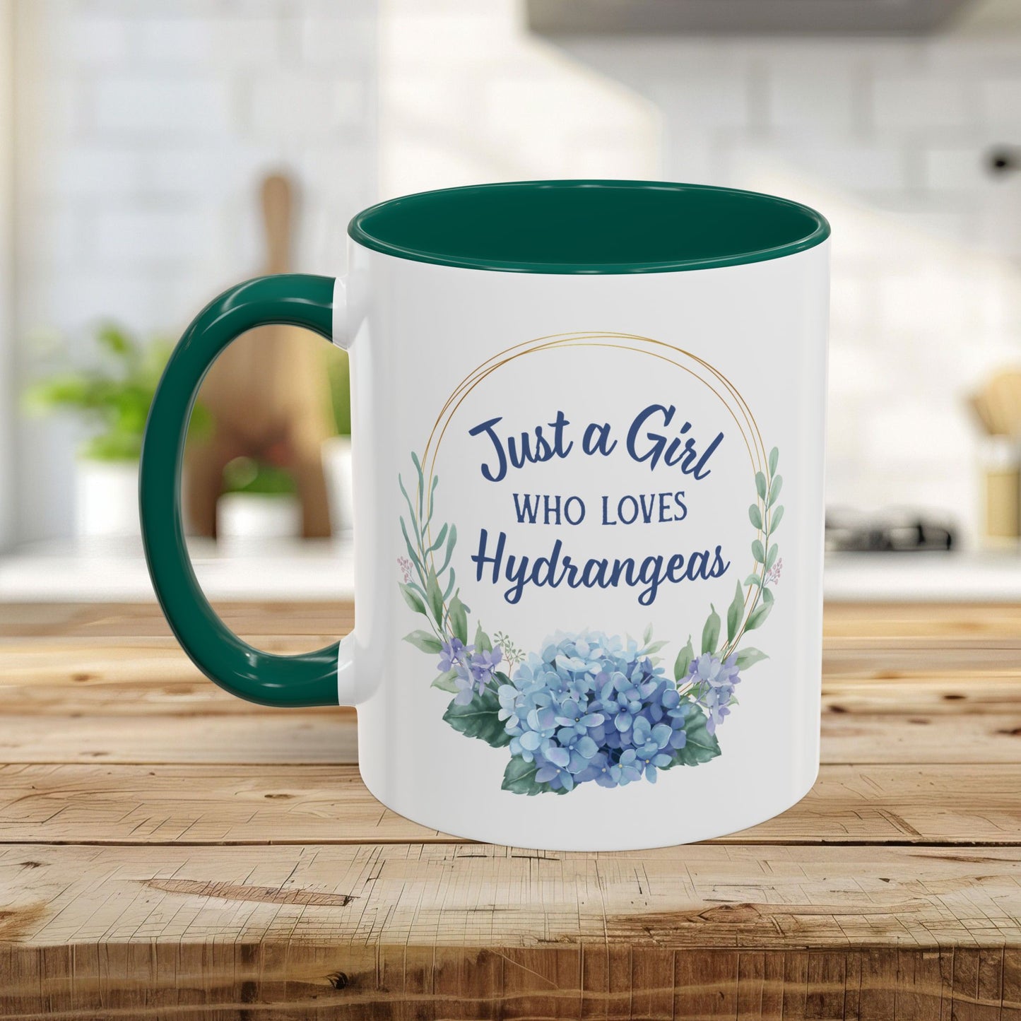 White ceramic mug with a green handle and interior, featuring a watercolor hydrangea wreath and "Just a Girl Who Loves Hydrangeas" text.