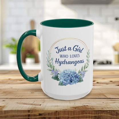 White ceramic mug with green interior and handle, featuring "Just a Girl Who Loves Hydrangeas" in a watercolor wreath.