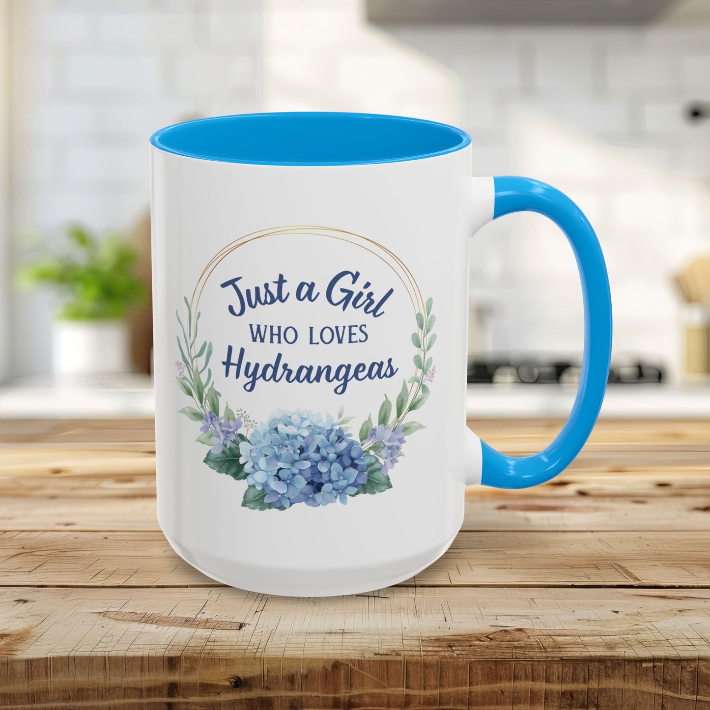 15oz white ceramic mug with light blue interior and handle, featuring a watercolor hydrangea wreath and "Just a Girl Who Loves Hydrangeas" text.