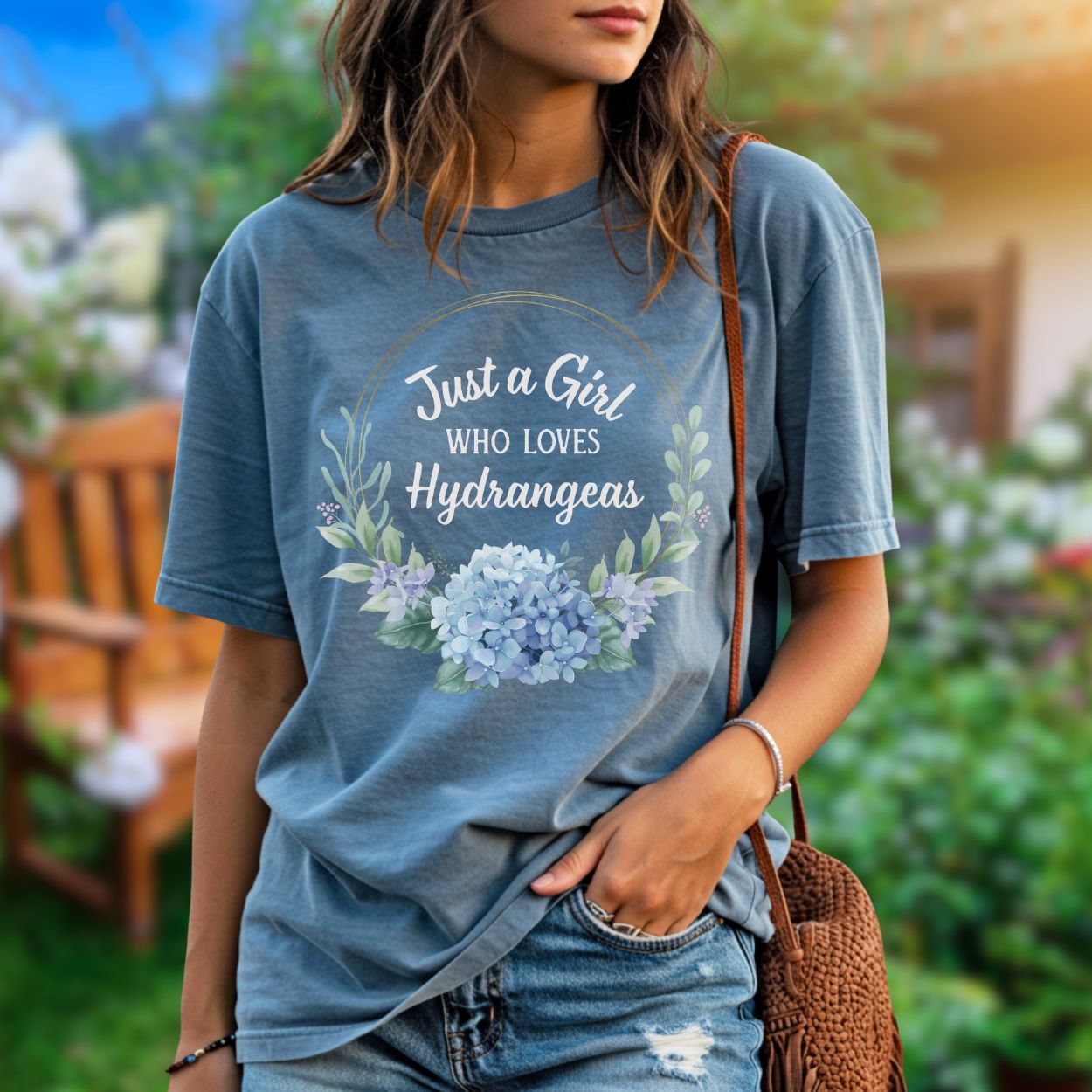 Garment-dyed blue t-shirt with "Just a Girl Who Loves Hydrangeas" text and a watercolor hydrangea bouquet.