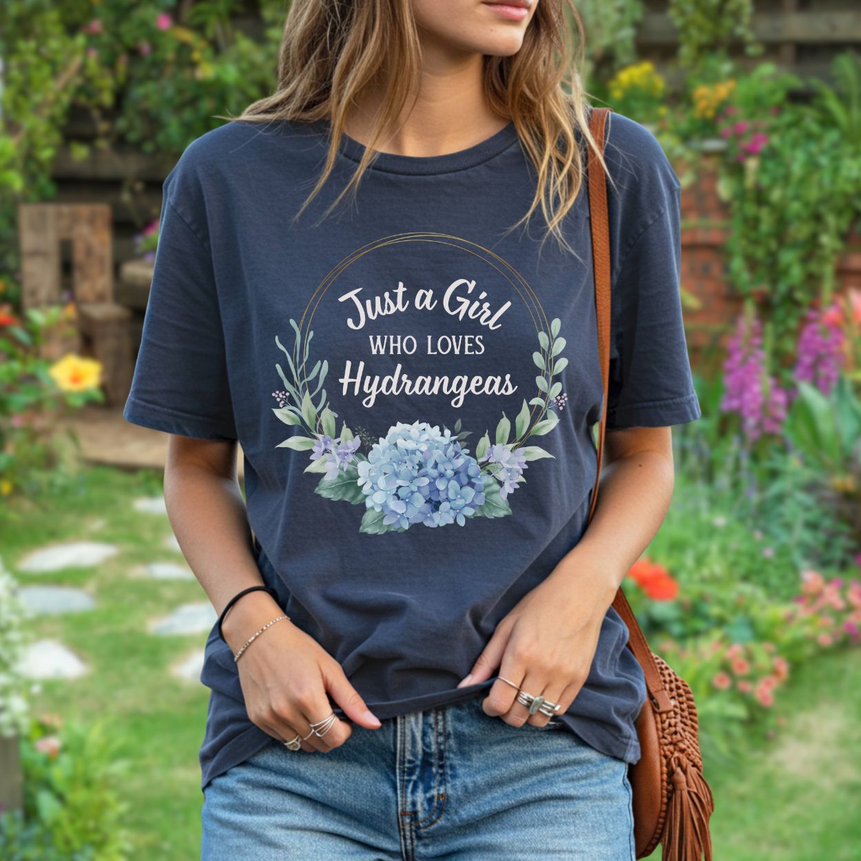 Navy garment-dyed cotton t-shirt with "Just a Girl Who Loves Hydrangeas" text and a watercolor hydrangea bouquet.