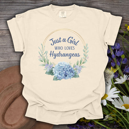 Ivory garment-dyed cotton t-shirt with "Just a Girl Who Loves Hydrangeas" in a watercolor floral wreath.