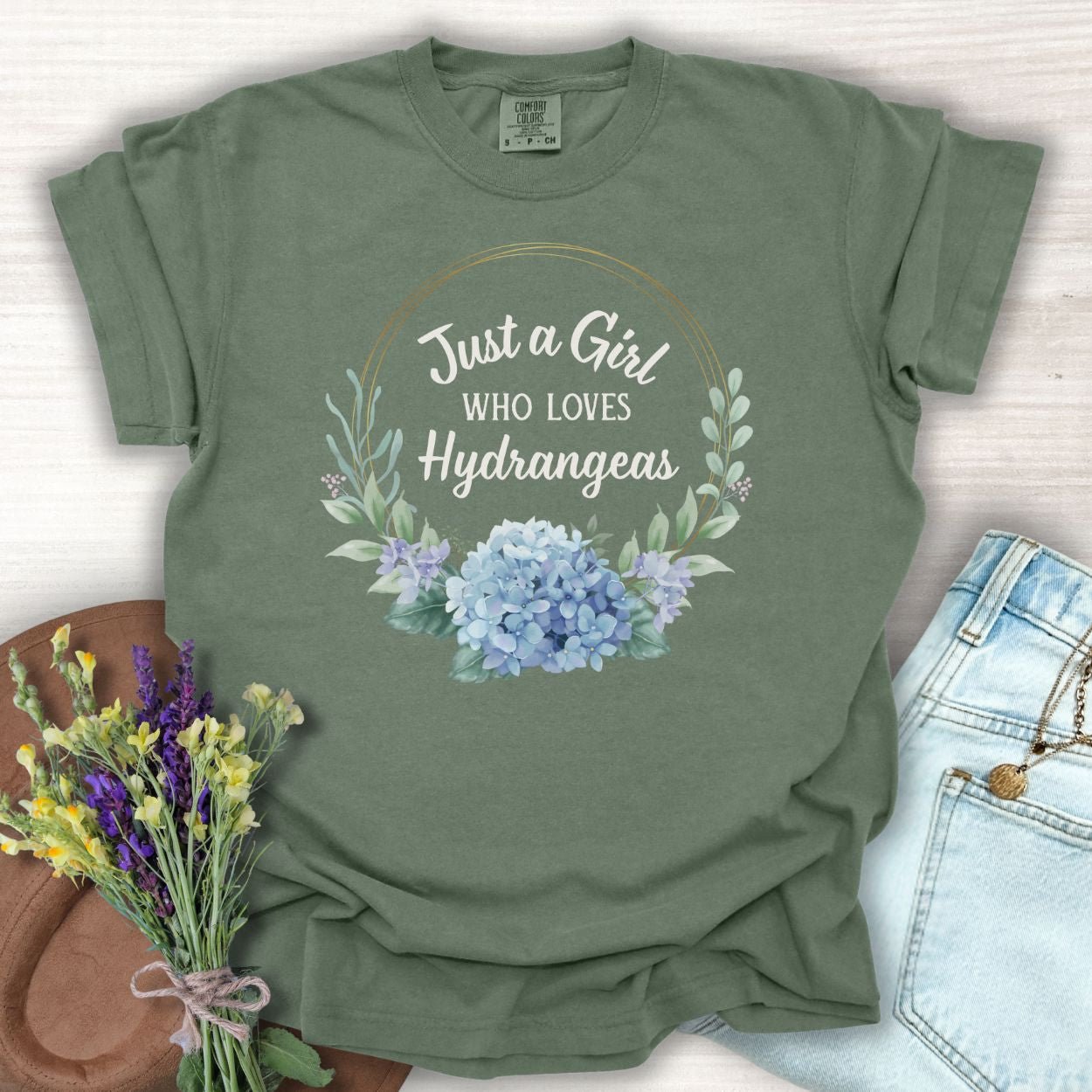 Moss green, relaxed-fit cotton t-shirt with "Just a Girl Who Loves Hydrangeas" in a floral wreath design.