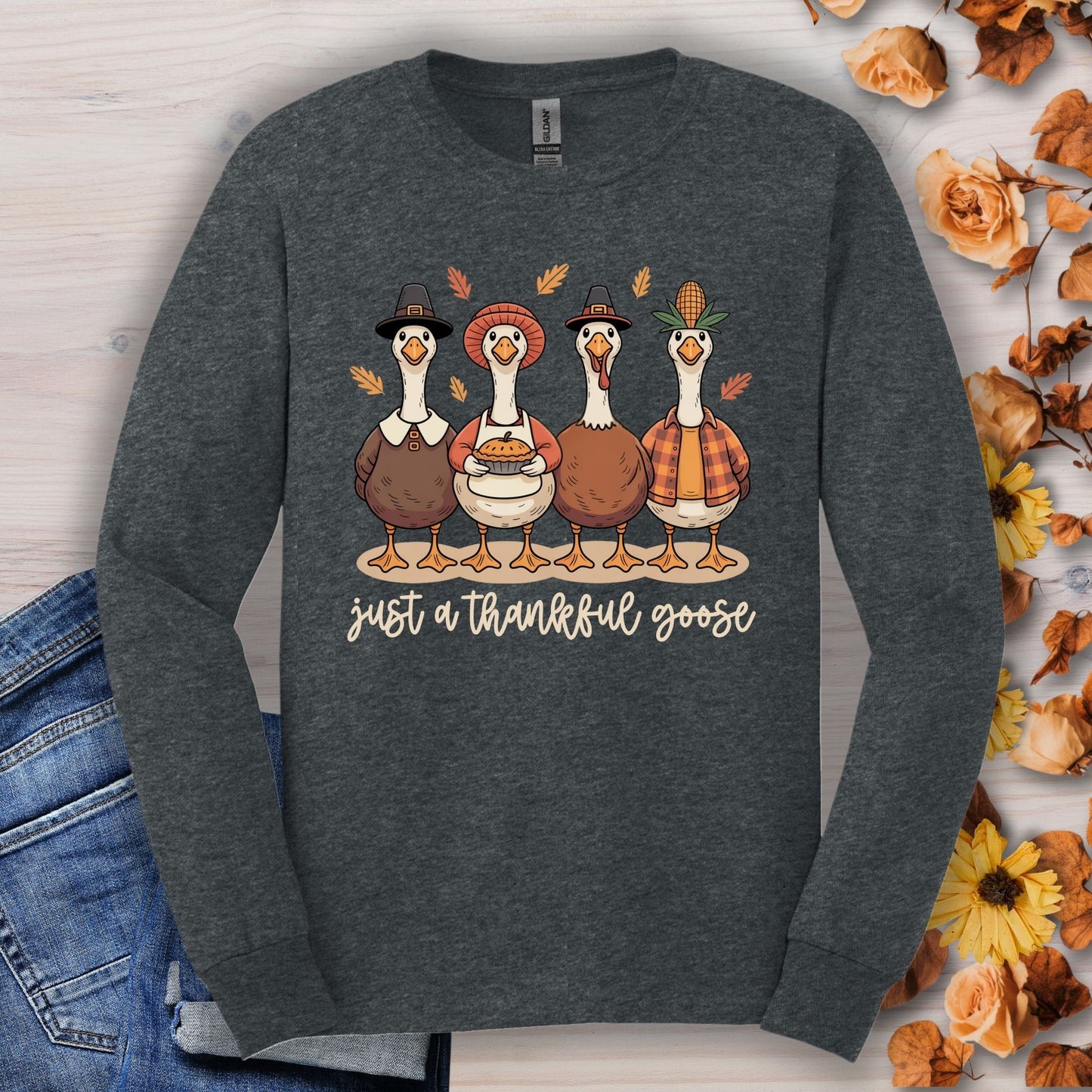 Dark Heather long sleeve tee with pilgrim ducks, pumpkin pie, and "just a thankful goose" text.