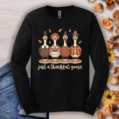 Black long sleeve tee with "Just a Thankful Goose" text and four pilgrim ducks eating pumpkin pie.