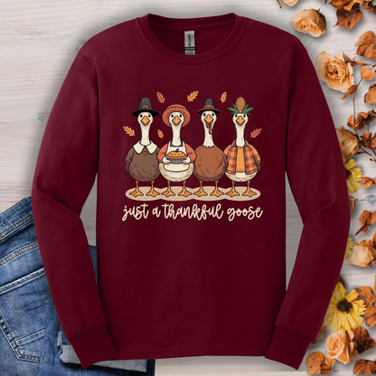 Maroon long sleeve tee with pilgrim ducks, pumpkin pie, and "just a thankful goose" text.