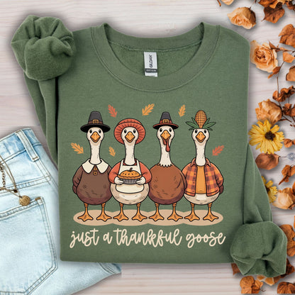 Military Green "Just a Thankful Goose" sweatshirt with pilgrim ducks, apple pie, and autumn leaves.